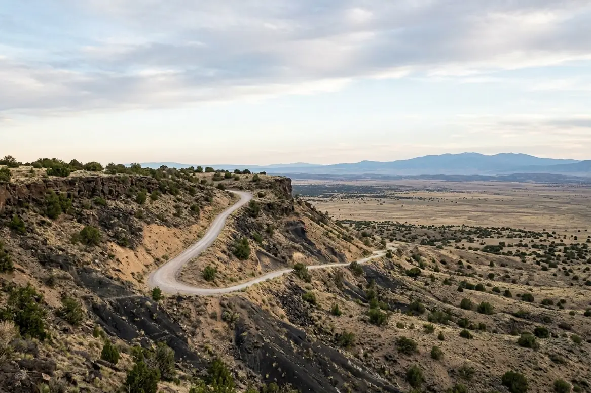 Old La Bajada road switchbacks climbing a dark basalt mesa in the New Mexico high desert