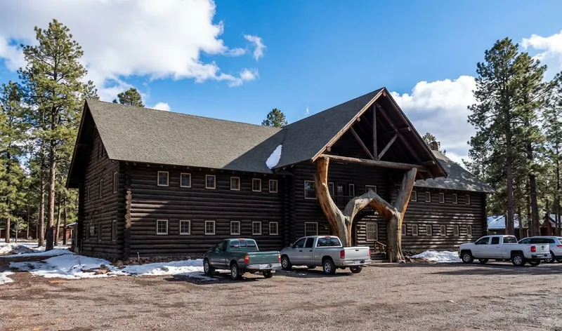 The Museum Club log roadhouse in Flagstaff, Arizona, with pines and melting snow