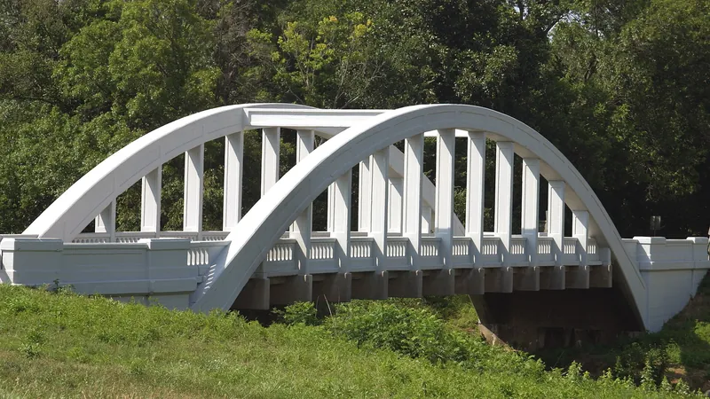 White concrete Brush Creek Rainbow arch bridge on old Route 66 near Riverton, Kansas