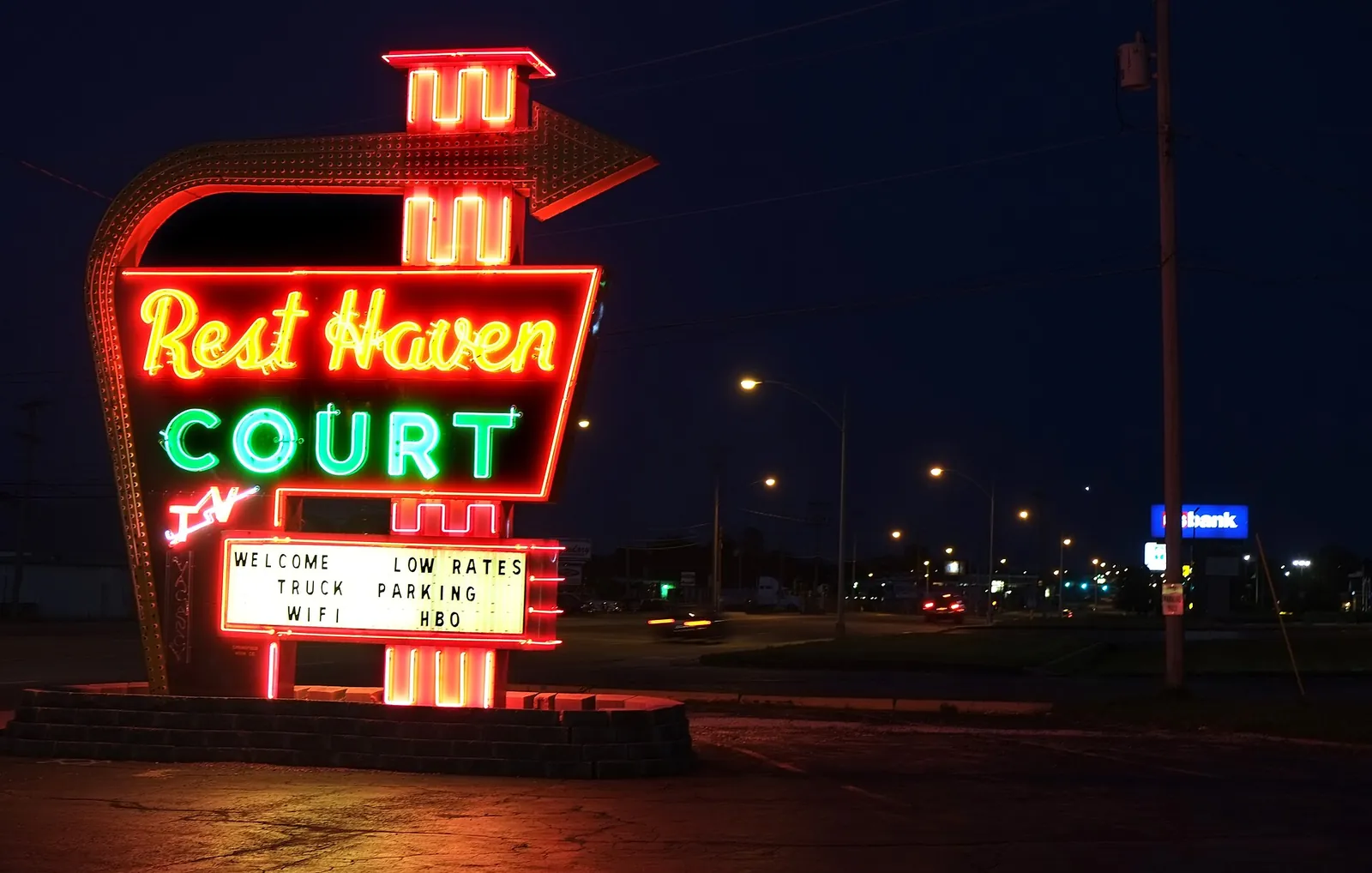 Rest Haven Court neon sign glowing red and green at night in Springfield, Missouri