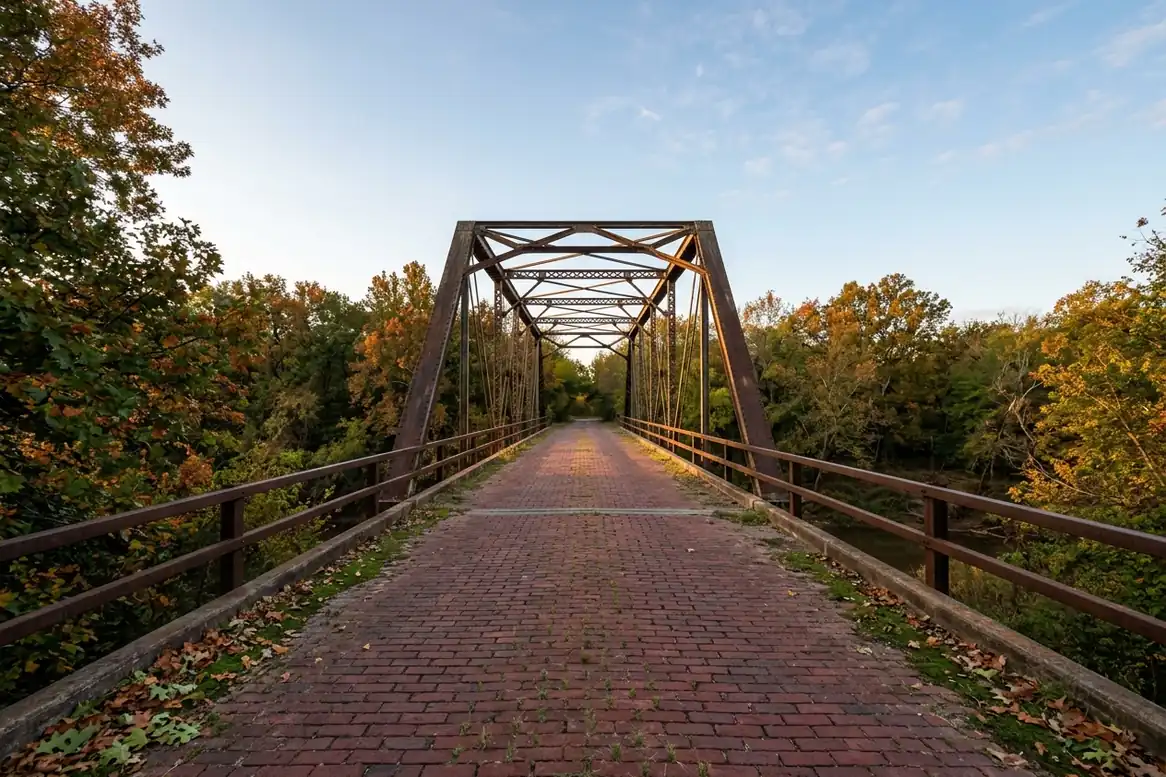 Red brick deck and steel truss of the Rock Creek Bridge near Sapulpa, Oklahoma, in autumn